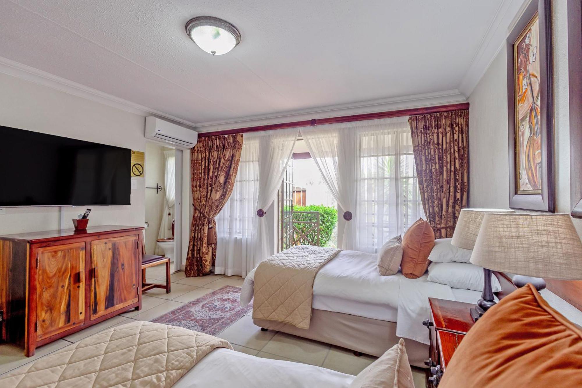 Afrique Boutique Hotel O.R. Tambo Boksburg Bilik gambar